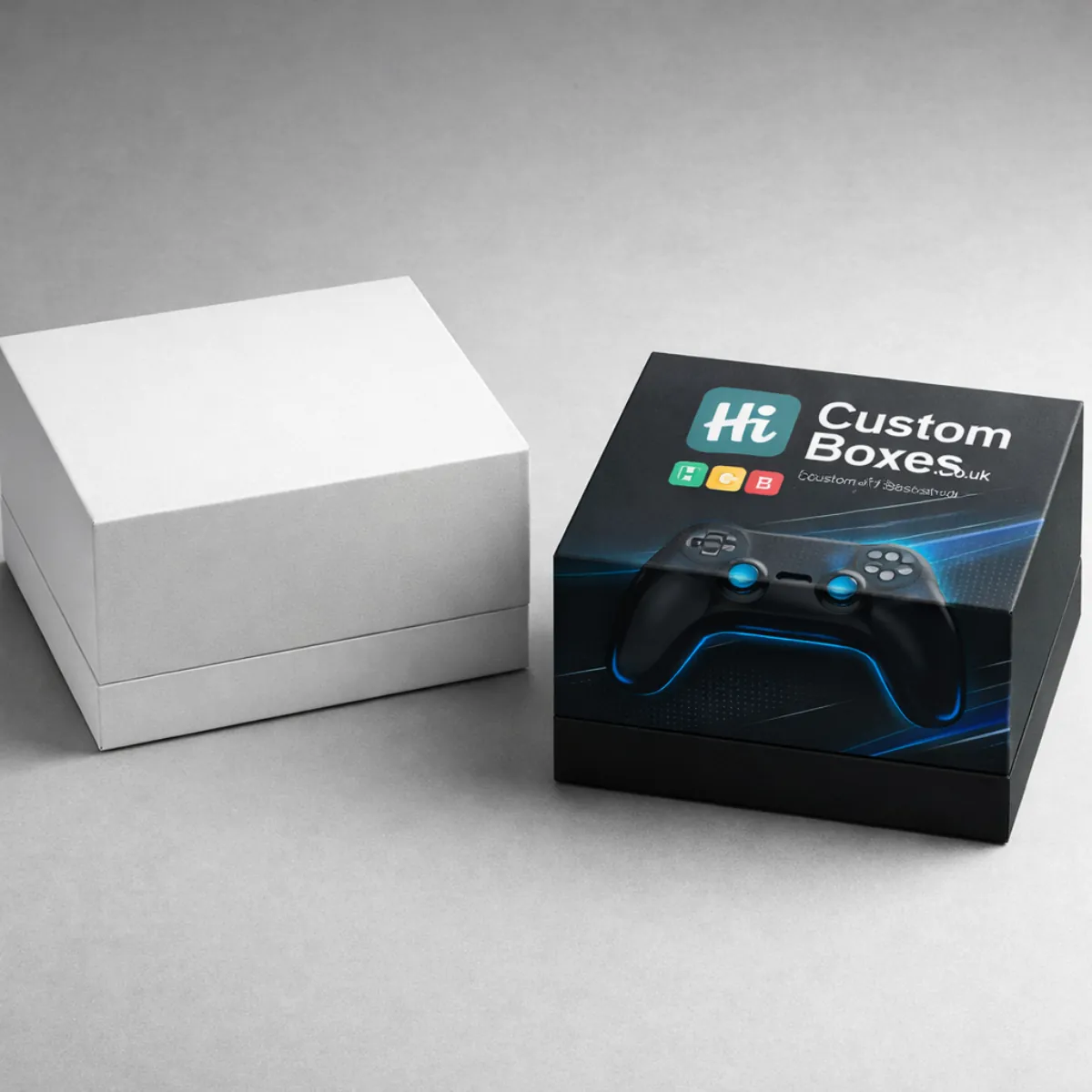 A minimalist white box and a premium black box with custom branding and controller imagery. class=